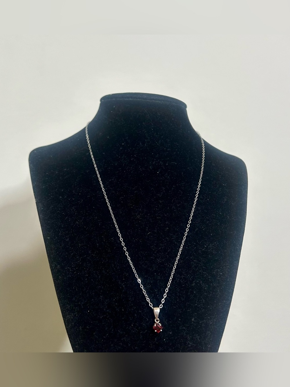 925 Sterling Silver with dark red gemstone